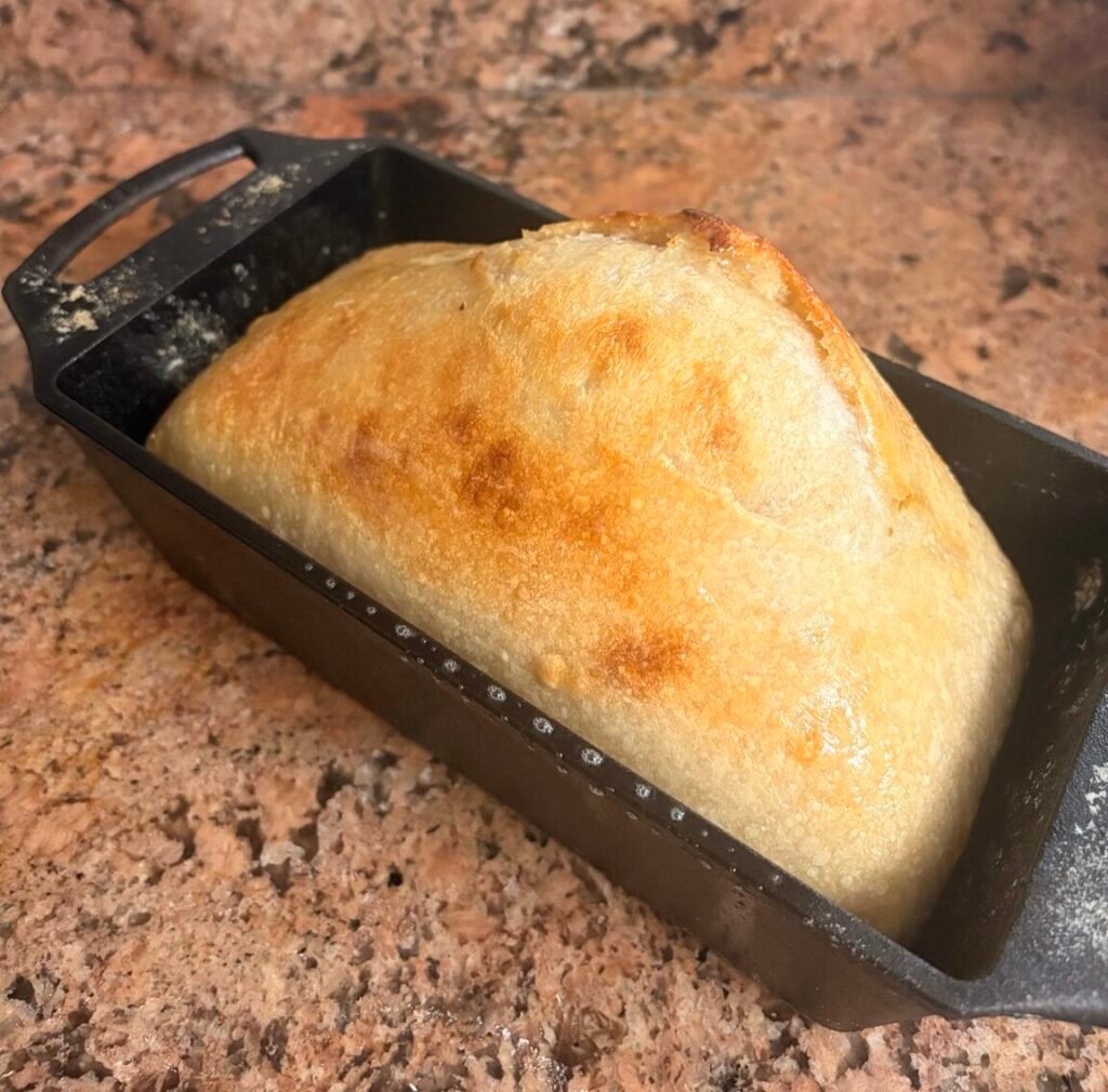 easy homemade bread recipe baked in a cast-iron bread pan